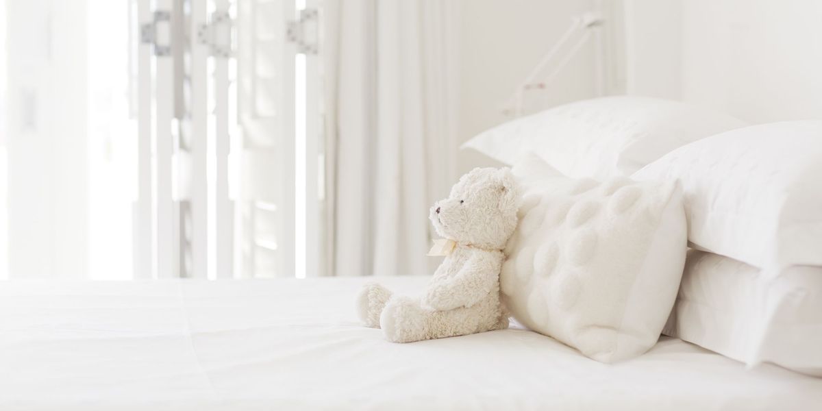 White, Bed sheet, Teddy bear, Stuffed toy, Product, Room, Textile, Bedding, Toy, Furniture, 