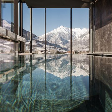 a large glass window overlooking a mountain