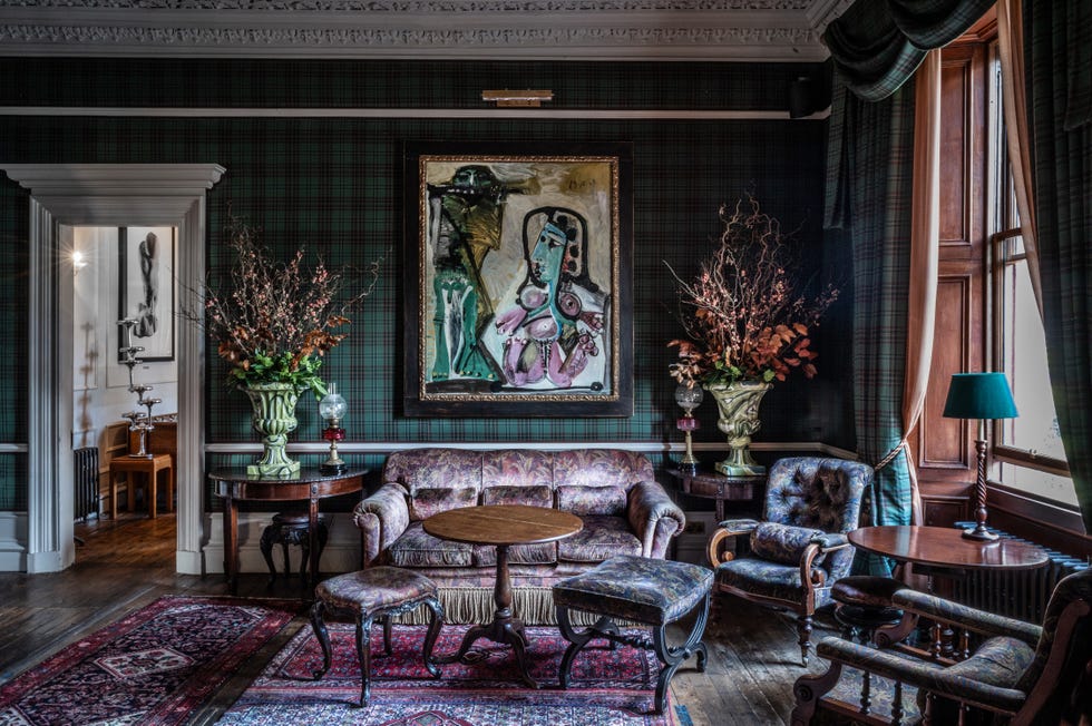 a room with tartan wallpaper at the fife arms hotel