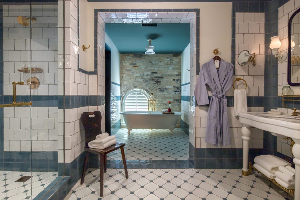 a bathroom with a tub and sink