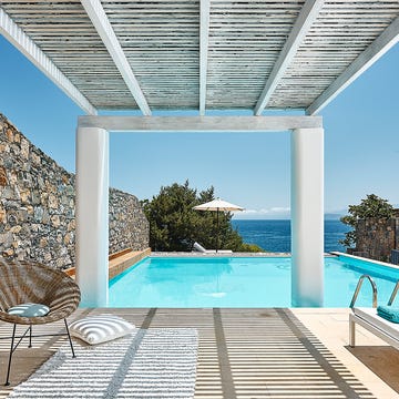 a pool with a stone wall