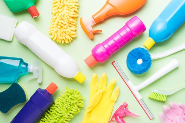 House cleaning product on green background