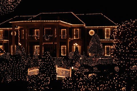house illuminated by christmas lights, hanging christmas lights , how to hang christmas lights outside