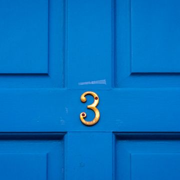house number 3 on a blue wooden front door