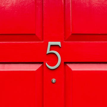 House Number 5 On A Red Wooden Front Door In London house number 5 on a red wooden front door in london