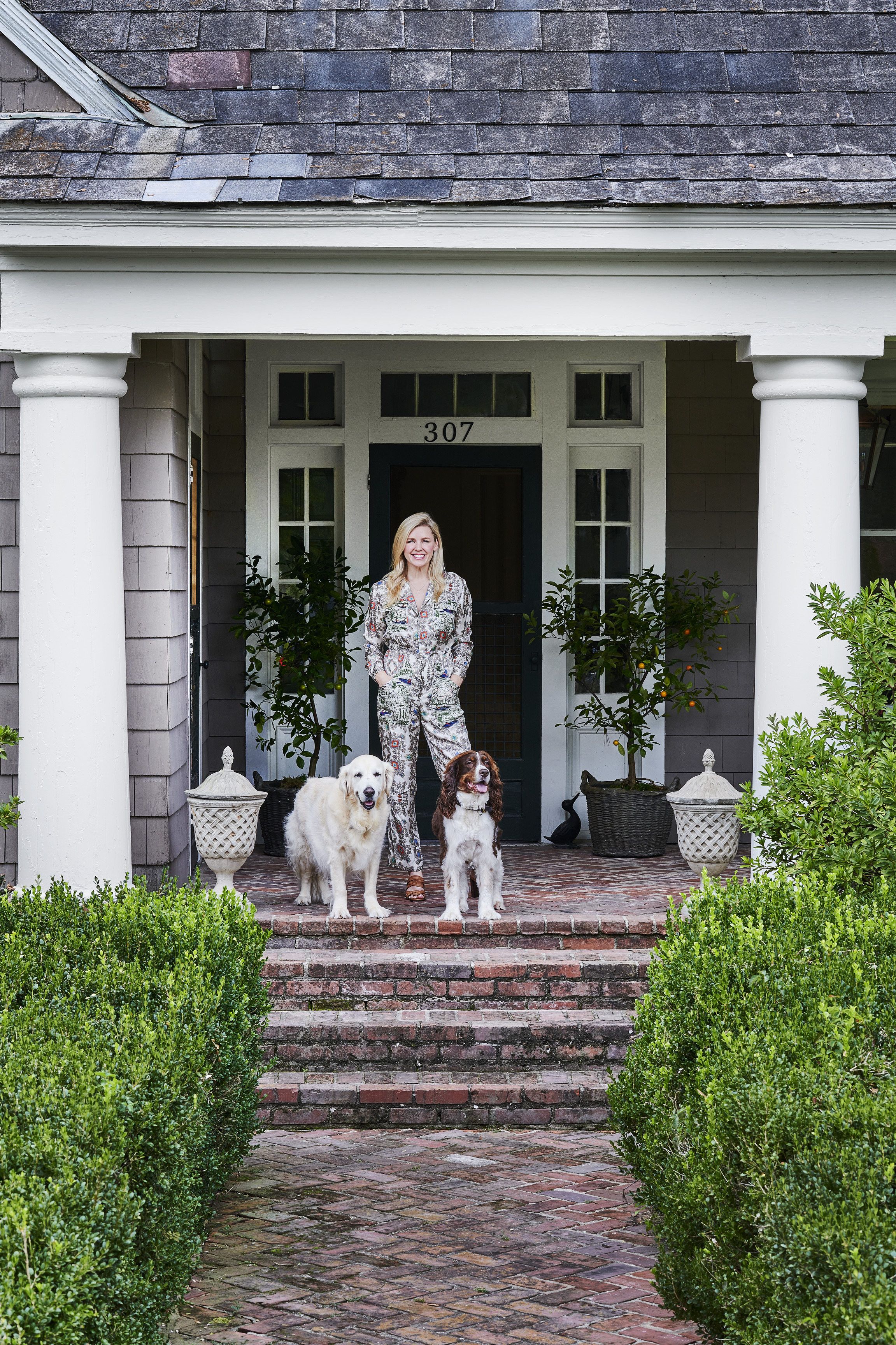 homeowner elizabeth poindexter shackelford with family dogs on her front porch in montrose arkansas