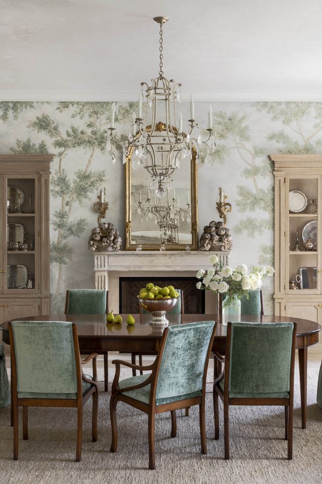 a woodland wall mural and mossy green velvet turn the dining room into a scenic extension of the out doors