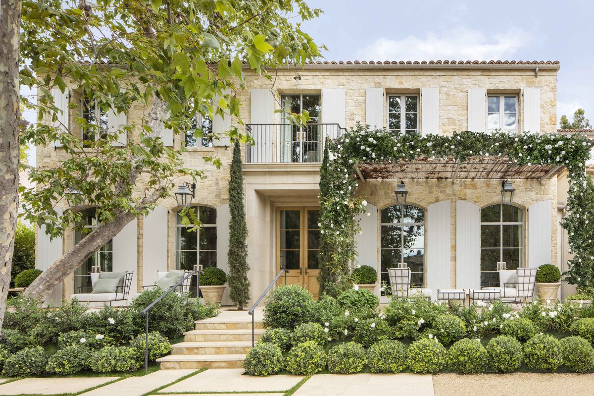 texas limestone gives the facade an aged appearance like an old european villa