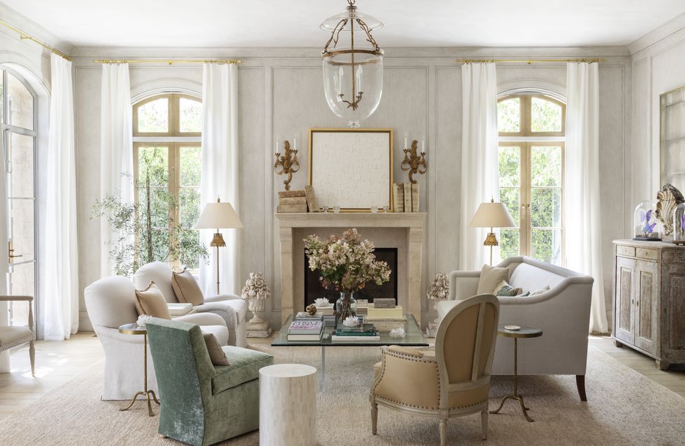 a formal living room stays connected to the garden via french doors that wrap the space