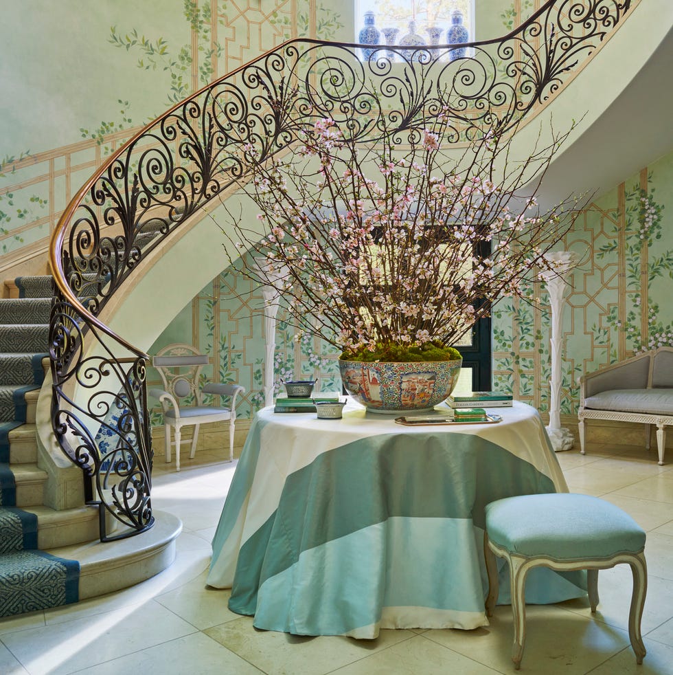 a chinese fretwork fresco by artist haleh atabeigi climbs the entrance hall