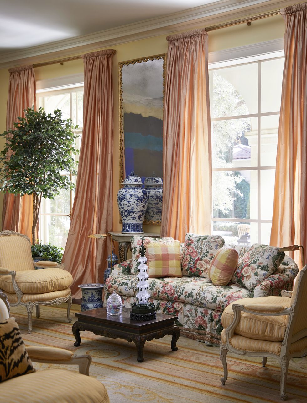 the living room’s soft sunset palette originated with an antique spanish rug