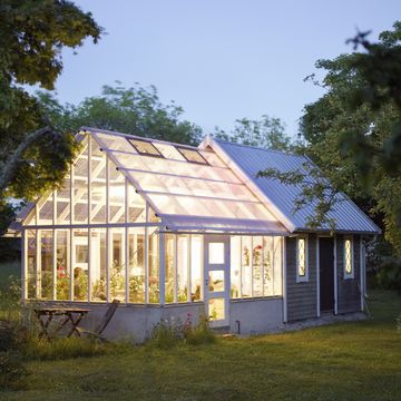 a house with a greenhouse sweden