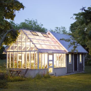 a house with a greenhouse sweden