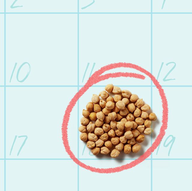 a pile of dried chickpeas against a blue background