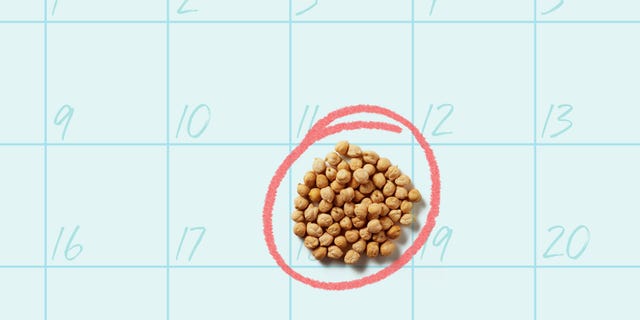 a pile of dried chickpeas against a blue background