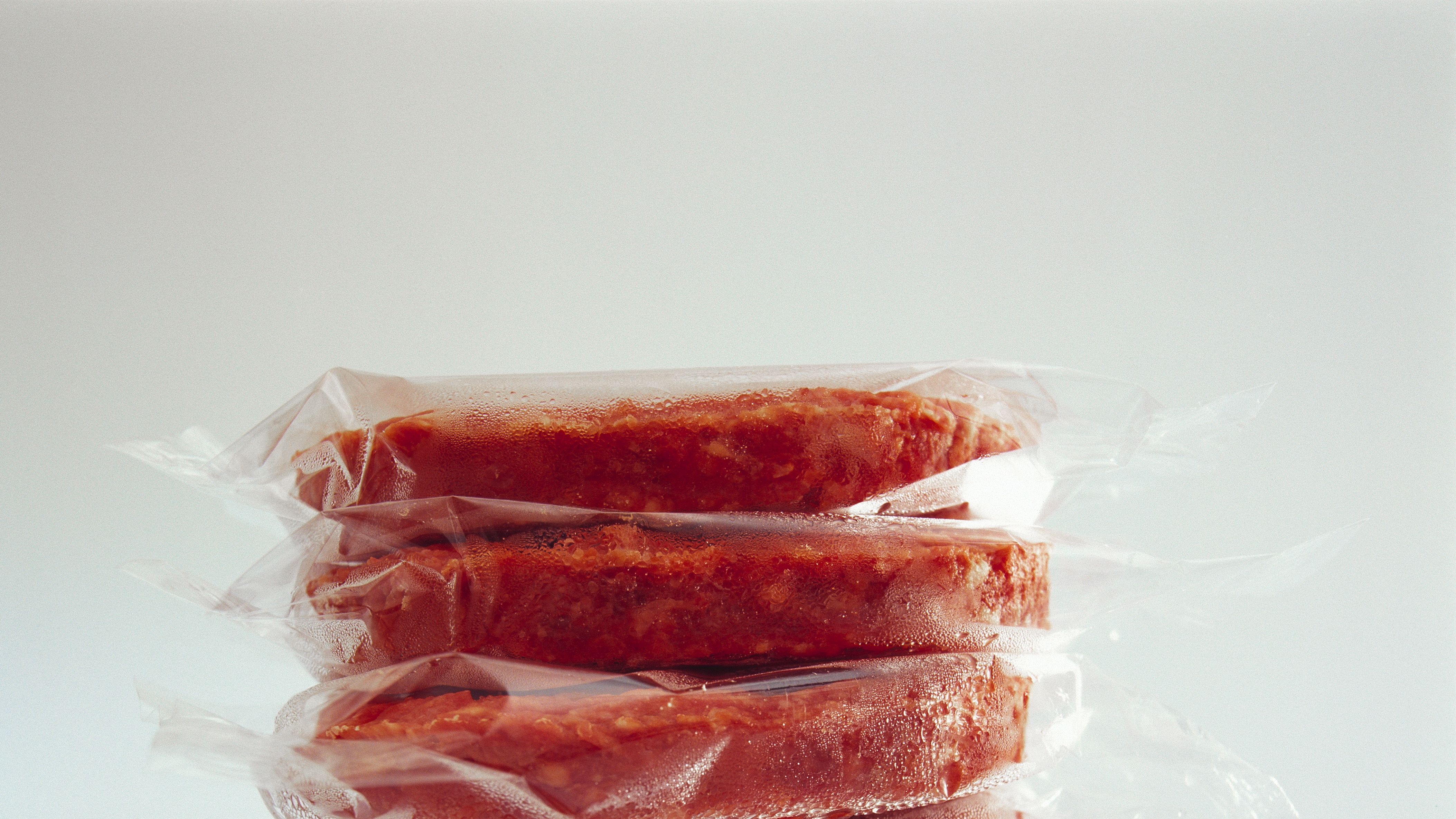 Is it necessary to re-wrap meats before freezing?
