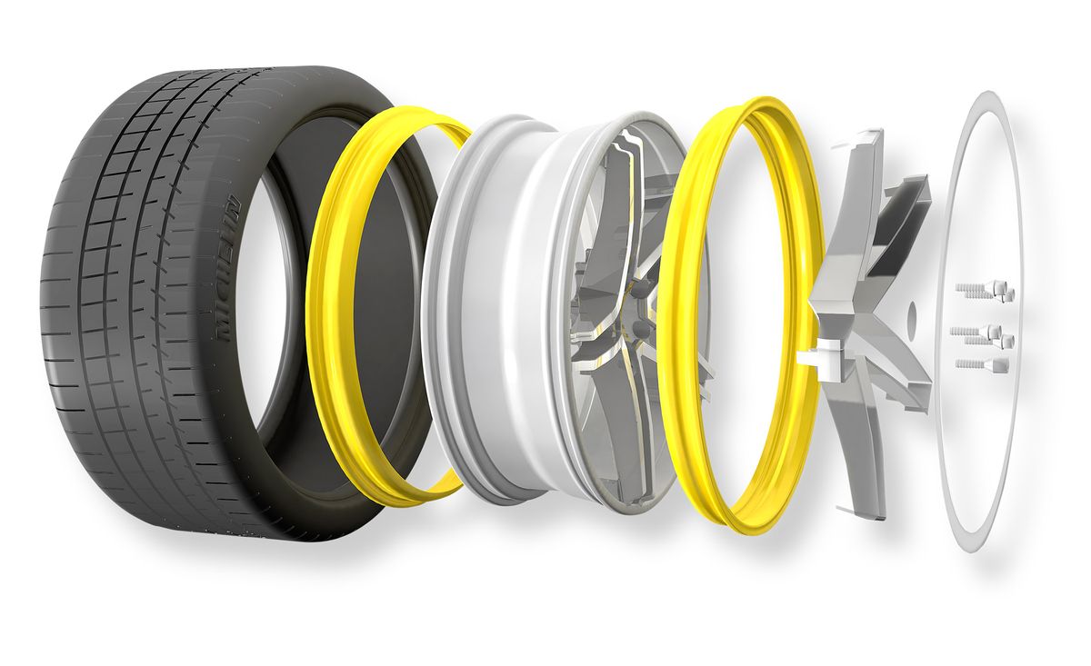 Tire, Automotive tire, Yellow, Synthetic rubber, Product, Wheel, Rim, Auto part, Automotive wheel system, Formula one tyres, 