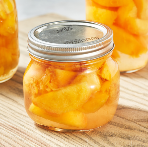 jar of homemade canned peaches