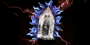 a quartz crystal surrounded by blue flames