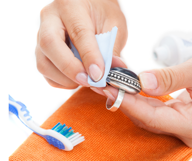 cleaning a silver ring using a cloth