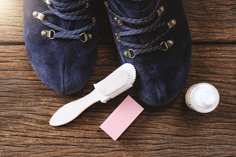 how to clean suede shoes, including the things you'll need such as a suede brush, an eraser, vinegar and a cloth