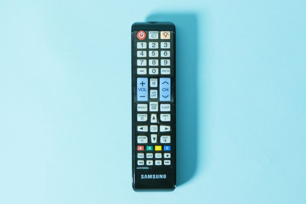 tv remote on blue background
