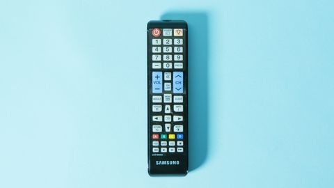tv remote on blue background