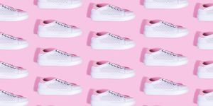 how to clean white shoes , multiple white shoes against a pink background