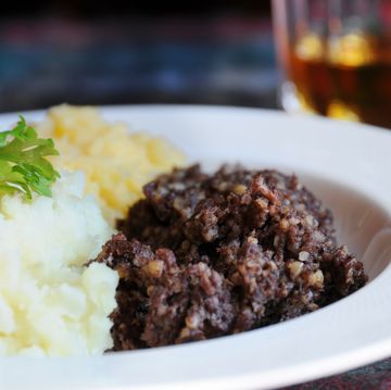 scottish meal of haggis, neeps and tatties and of course a wee dram narrow depth of field on haggis traditional meal for rabbie burns night