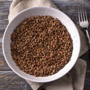 bowl of lentils on wood with napkin
