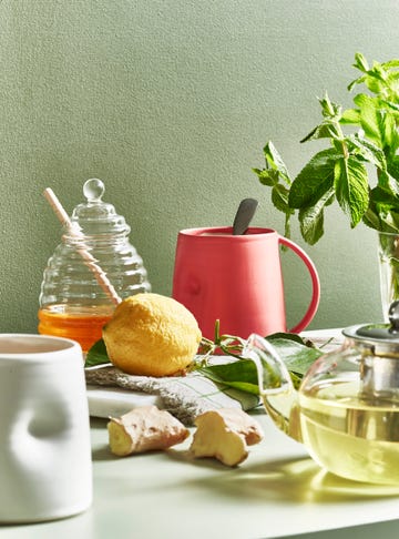 table with lemons and fresh mint plant