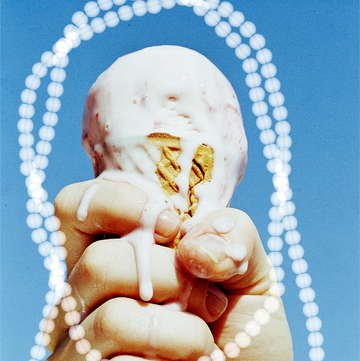 woman's hand gripping a melting ice cream cone