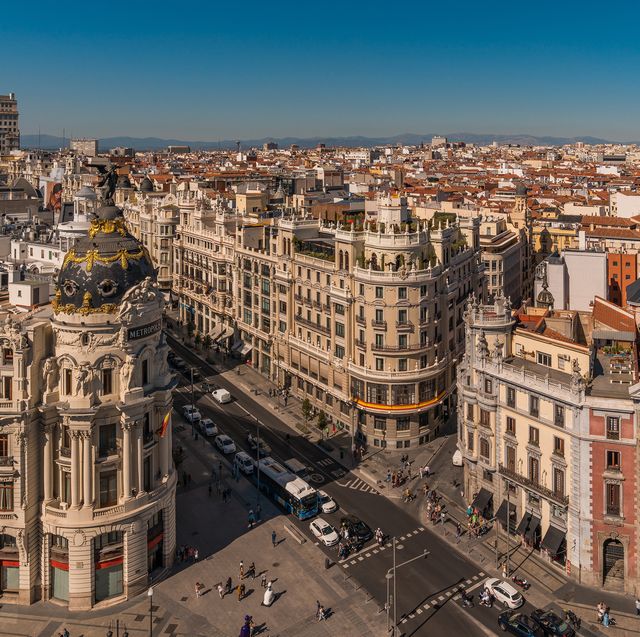downtown madrid, spain, where the calle de alcala meets the gran via these are two of the most famous and busy streets in madrid