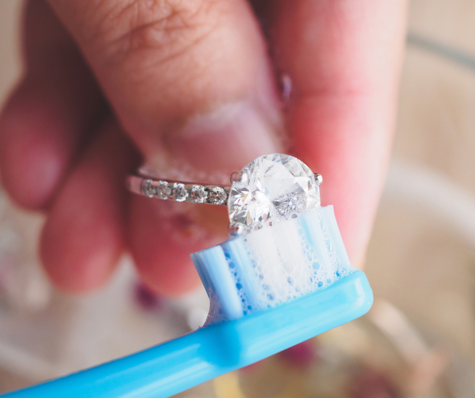 cleaning a ring with a toothbrush