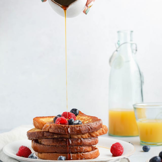 golden syrup being poured onto french toast