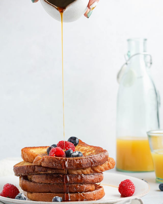 how to make french toast golden syrup being poured onto french toast