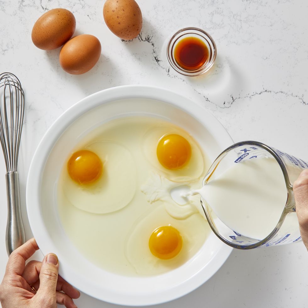 eggs and milk mixed together in a pan