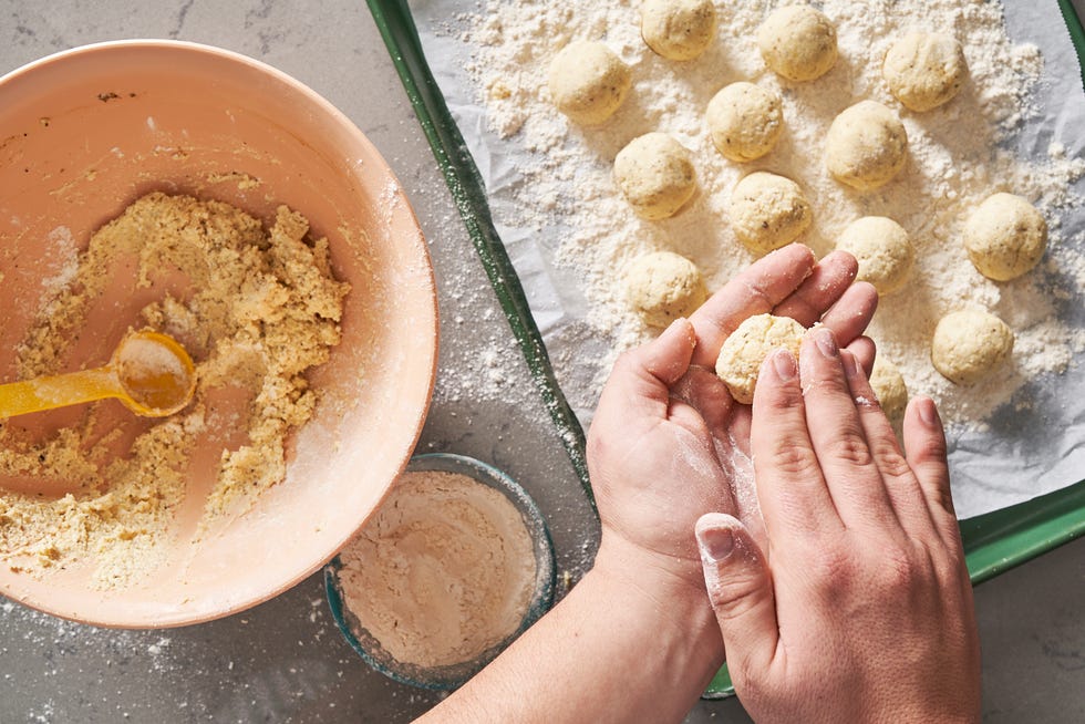ricotta mixture getting rolled into gnudi balls