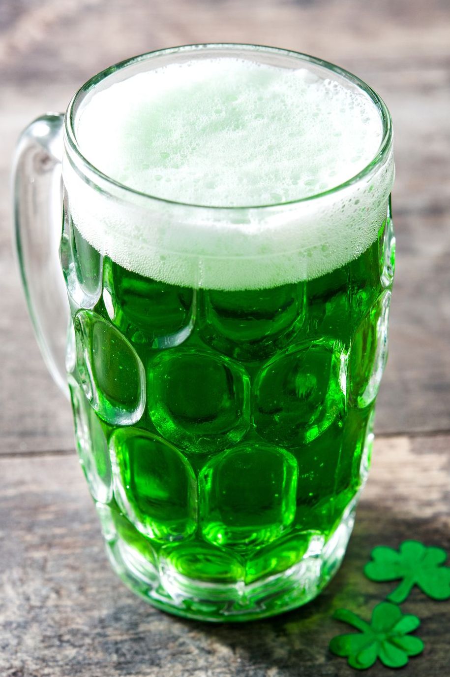 pint of green beer with clover decoration