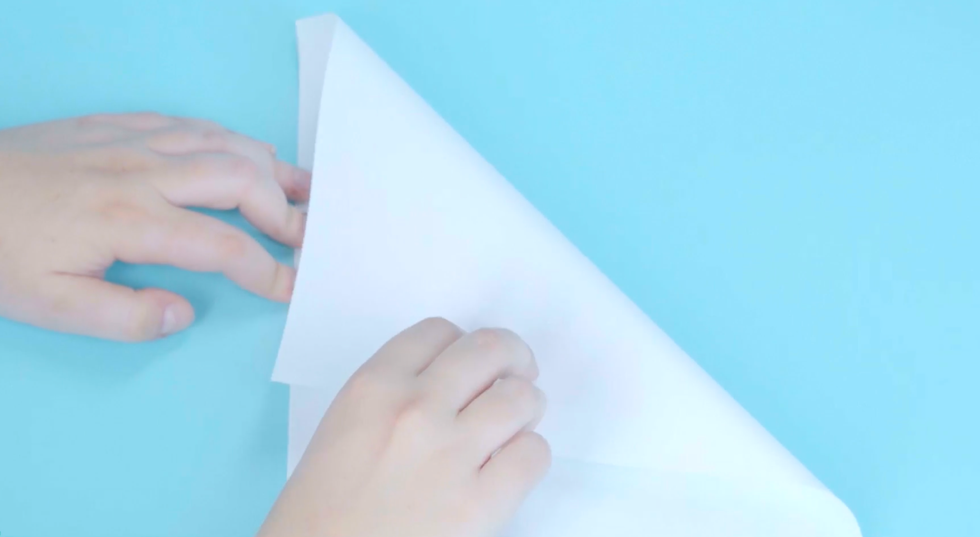 how to make paper snowflakes how to make paper snowflakes, hand folding white paper diagonally