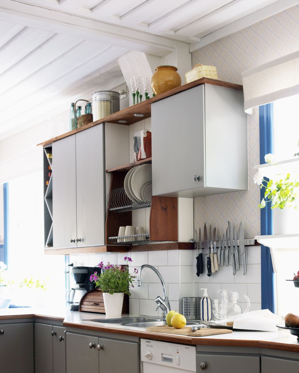 https://hips.hearstapps.com/hmg-prod/images/how-to-organize-kitchen-cabinets-rarely-used-items-high-6584a638d3813.jpg?crop=0.680xw:0.637xh;0.150xw,0&resize=980:*