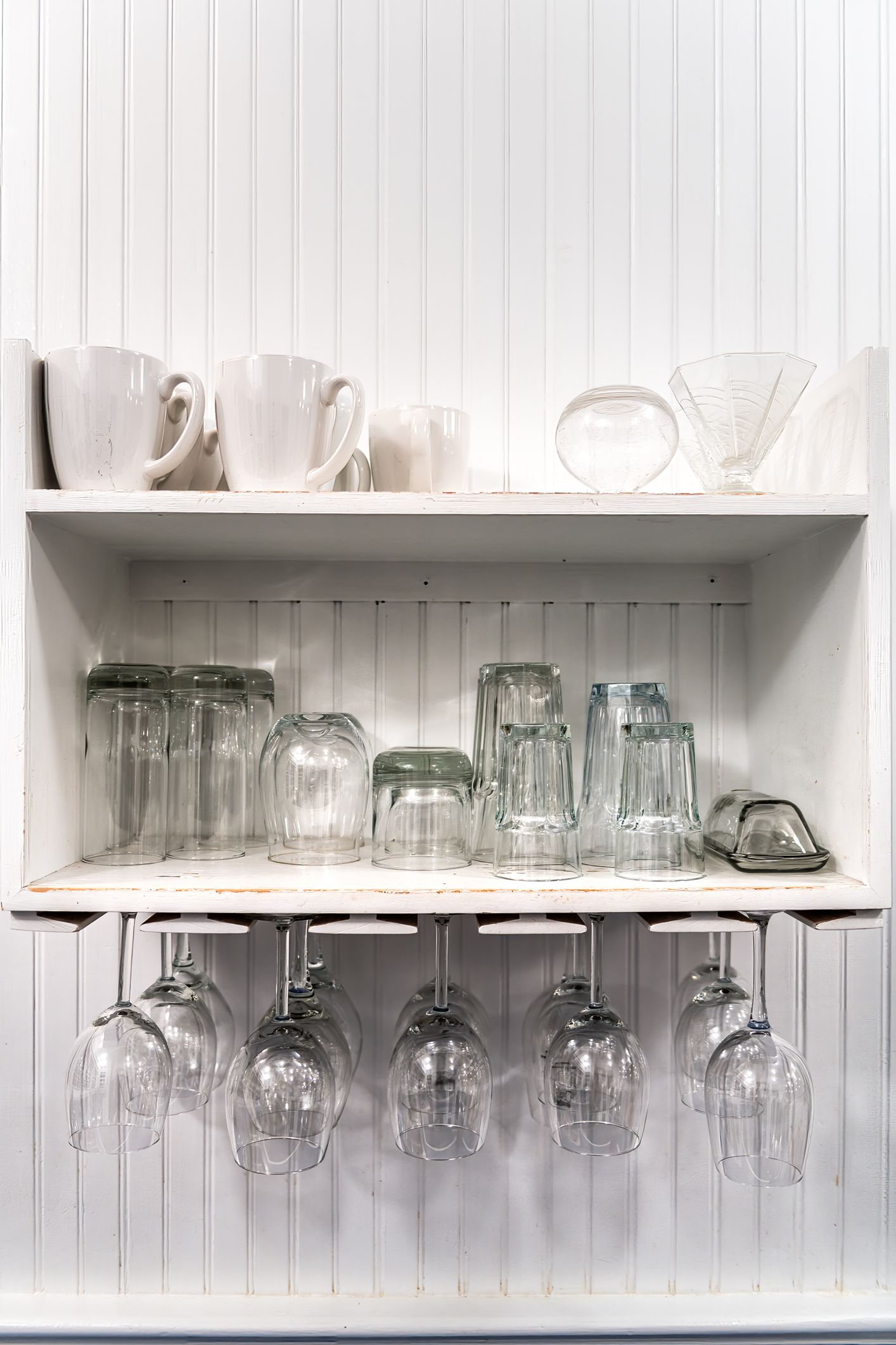 https://hips.hearstapps.com/hmg-prod/images/how-to-organize-kitchen-cabinets-under-cabinet-wine-glass-rack-6584a1a4ebbf9.jpg