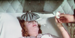 a person lying in a hospital bed