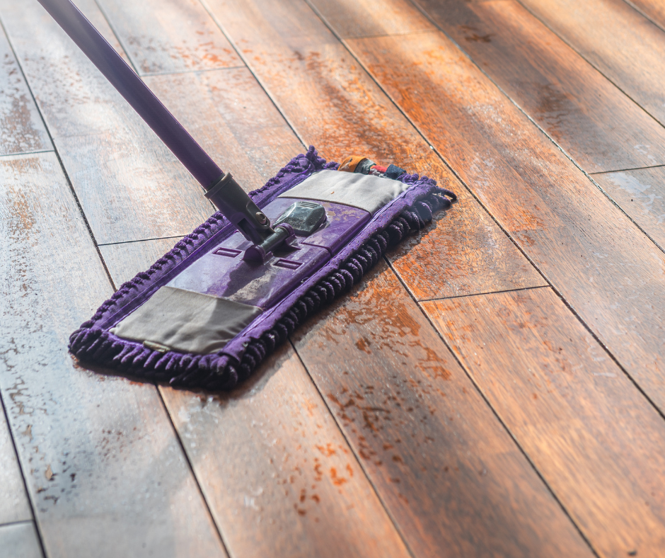 mop on wet wooden floor