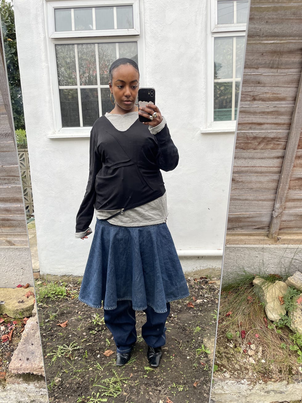 amel mukhtar styles a skirt over trousers