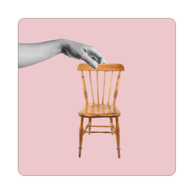 a hand on a chair