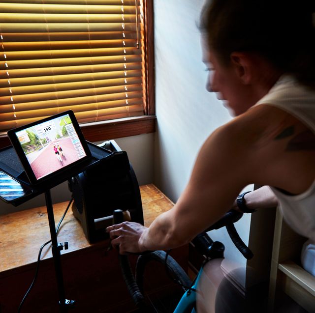 bike trainer set up a person riding zwift