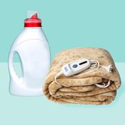 electric blanket with detergent on white background