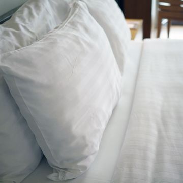 white pillows on bed