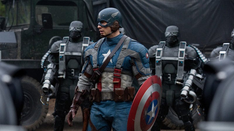 captain america brandishes a shield in a scene from captain america the first avenger, the fifth movie if you want to watch all the marvel movies in order